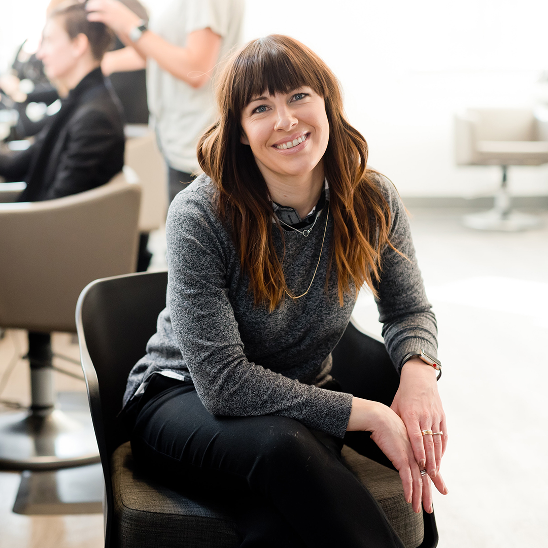 Smiling hair stylist