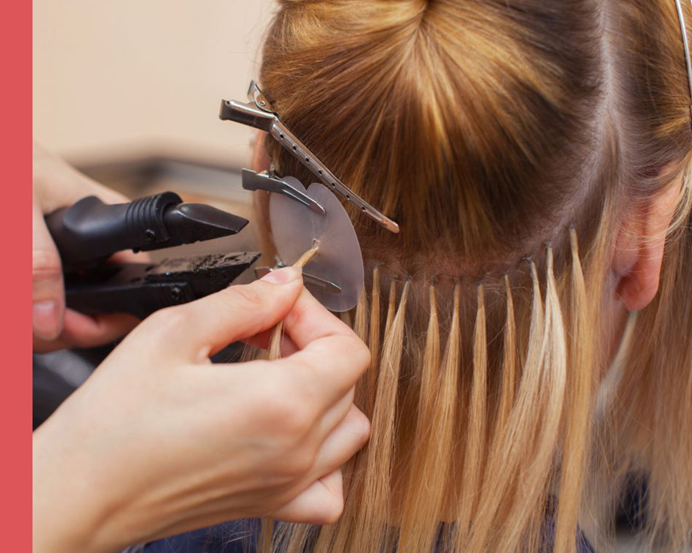 hair extensions being put in